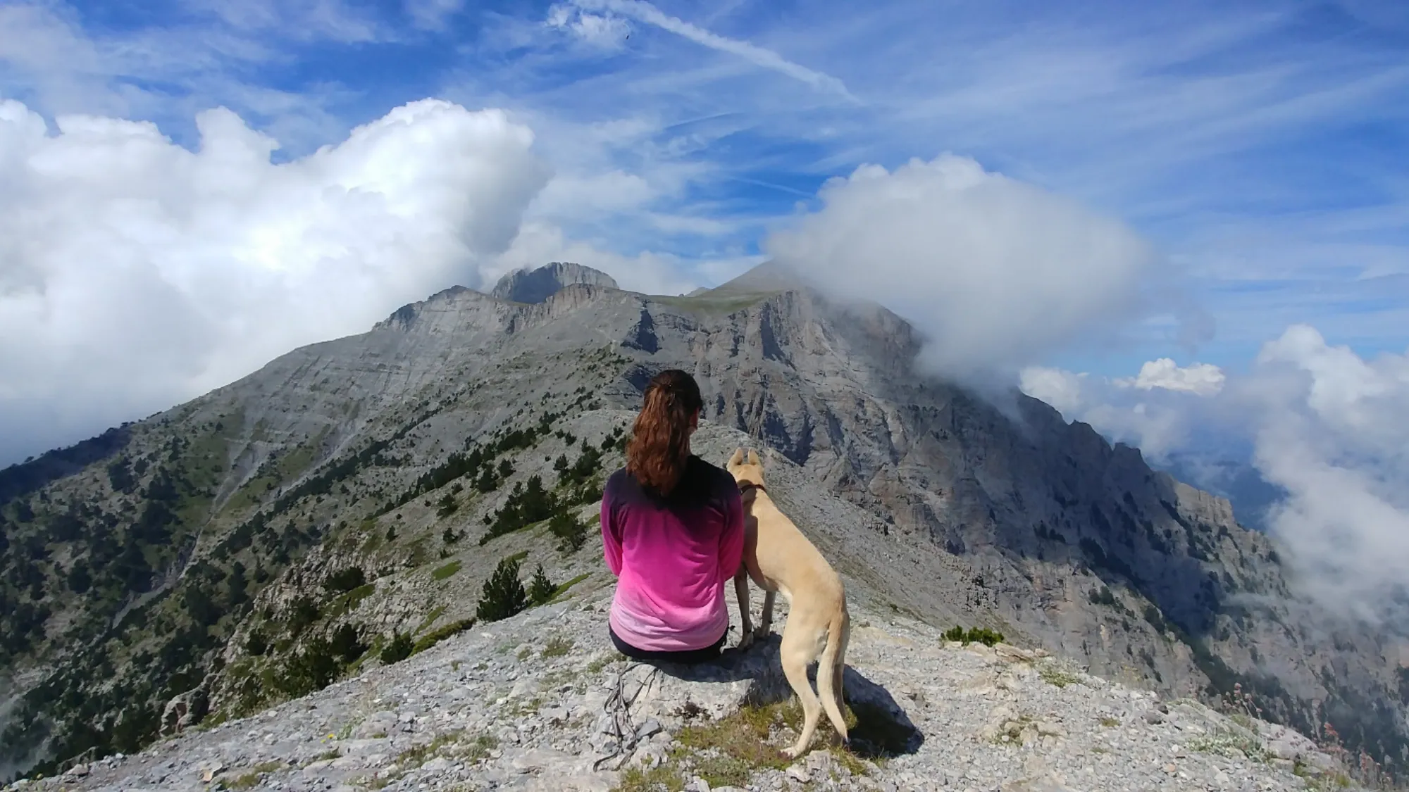 host Maria with dog Ruby on Mount Olympus